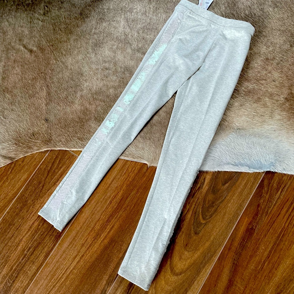 J Crew for kids.  Adorable leggings with a tuxedo ribbon of sequins!